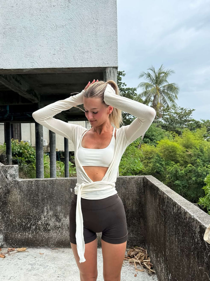 Everyday style women's wrap front long sleeve V-neck top, versatile activewear.