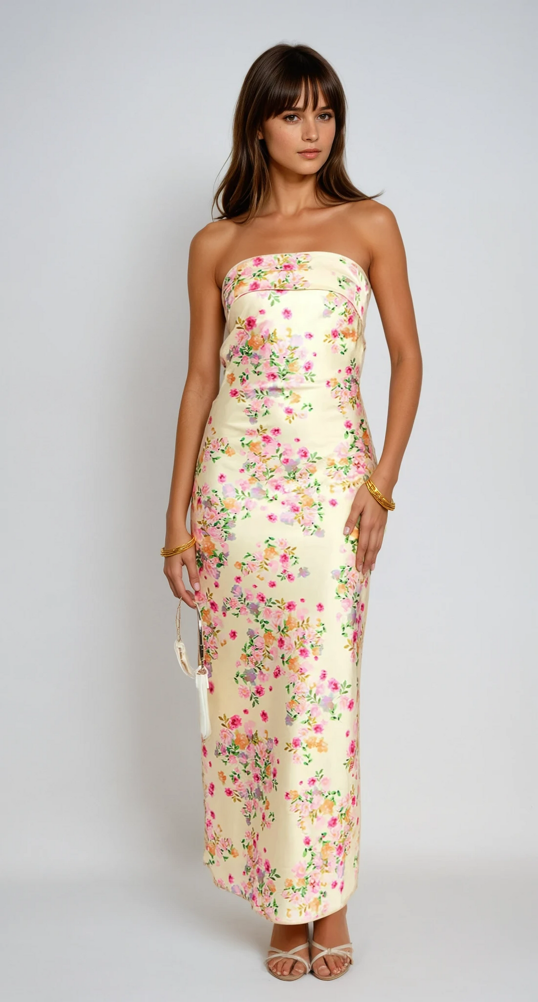 Women's yellow floral strapless maxi dress, perfect for summer vacations and elegant parties.