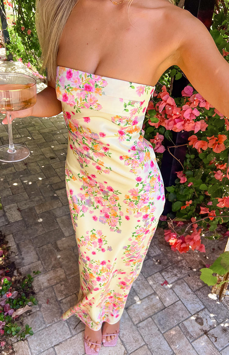 Flowy yellow floral summer maxi dress for women, ideal for beach, vacation, or elegant events.