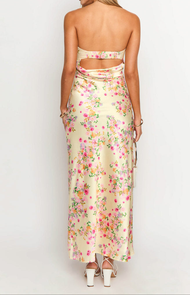 Elegant women's yellow floral strapless maxi dress with a flowing silhouette, perfect for summer.