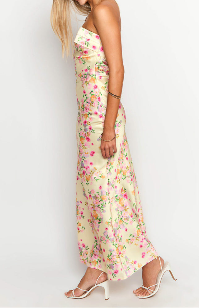 Yellow floral strapless maxi dress for women, elegant and flowy, ideal for summer parties & travel.