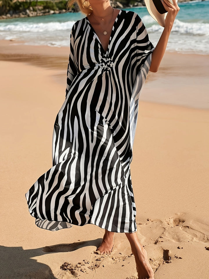 Elegant women's V-neck zebra print maxi dress, a comfortable and flowing option for beach fashion.