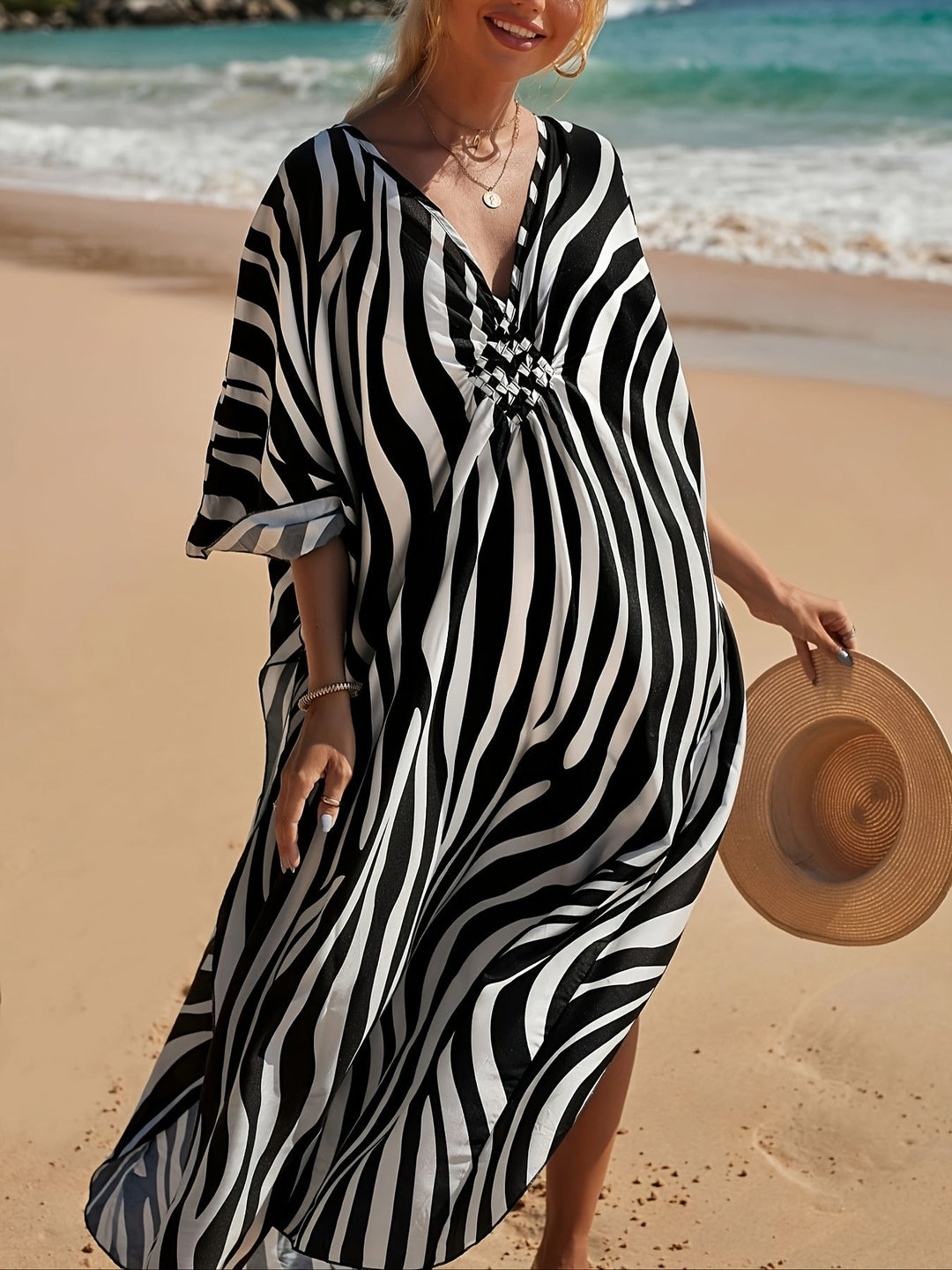 Chic women's zebra print V-neck maxi vacation dress, embodying casual elegance for summer trips.