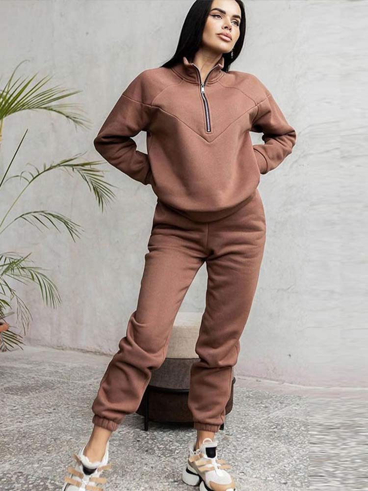 Women's zip neck tracksuit set, perfect for casual wear. Features a comfy top & matching pants for everyday style.