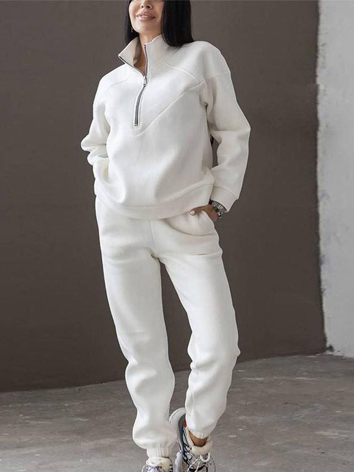 Full women's matching tracksuit set. Zip neck top & pants offer effortless casual style and comfy everyday wear.