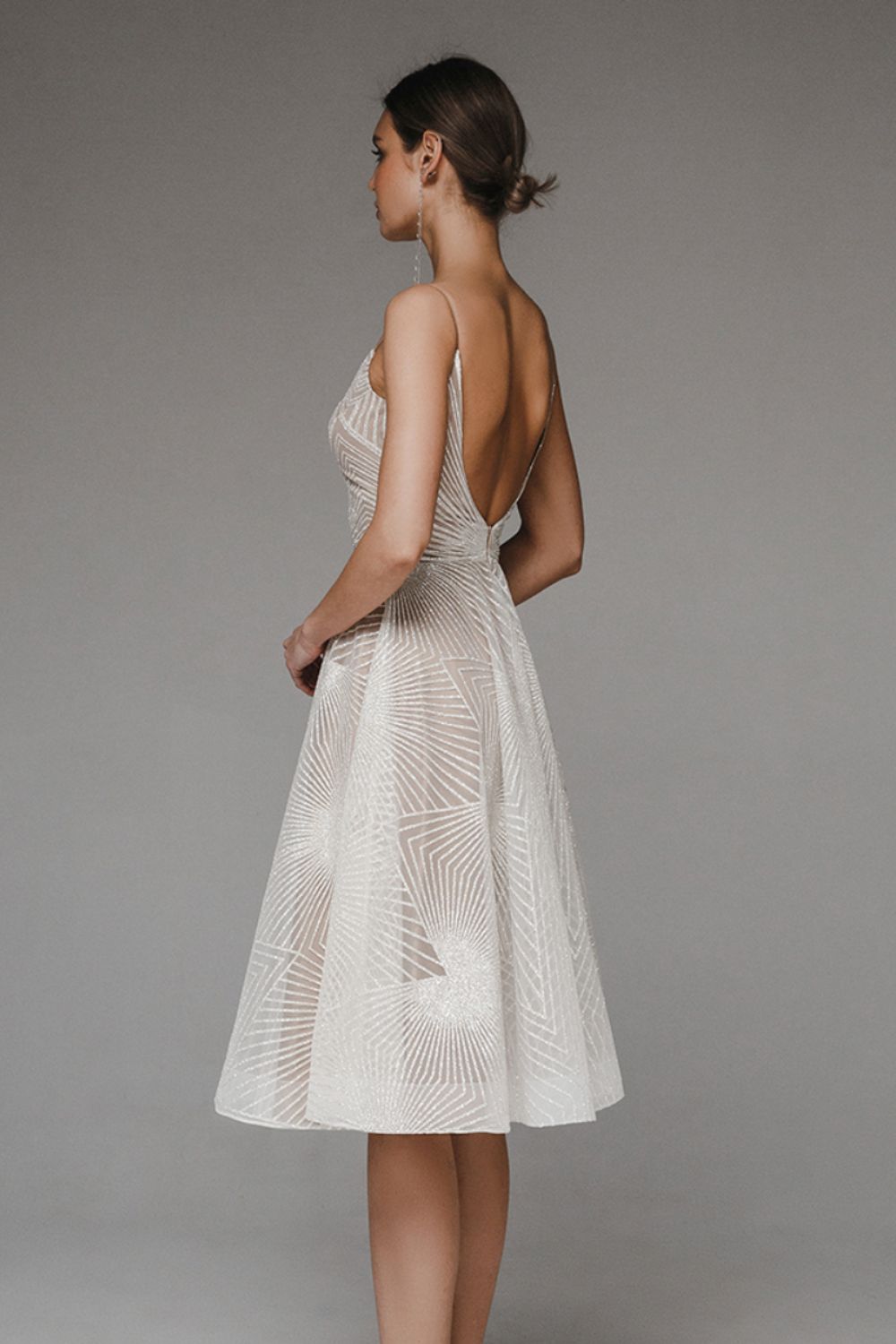 Women's A-Line evening dress with chiffon overlay, geometric pattern, and spaghetti straps, elegant for formal occasions.