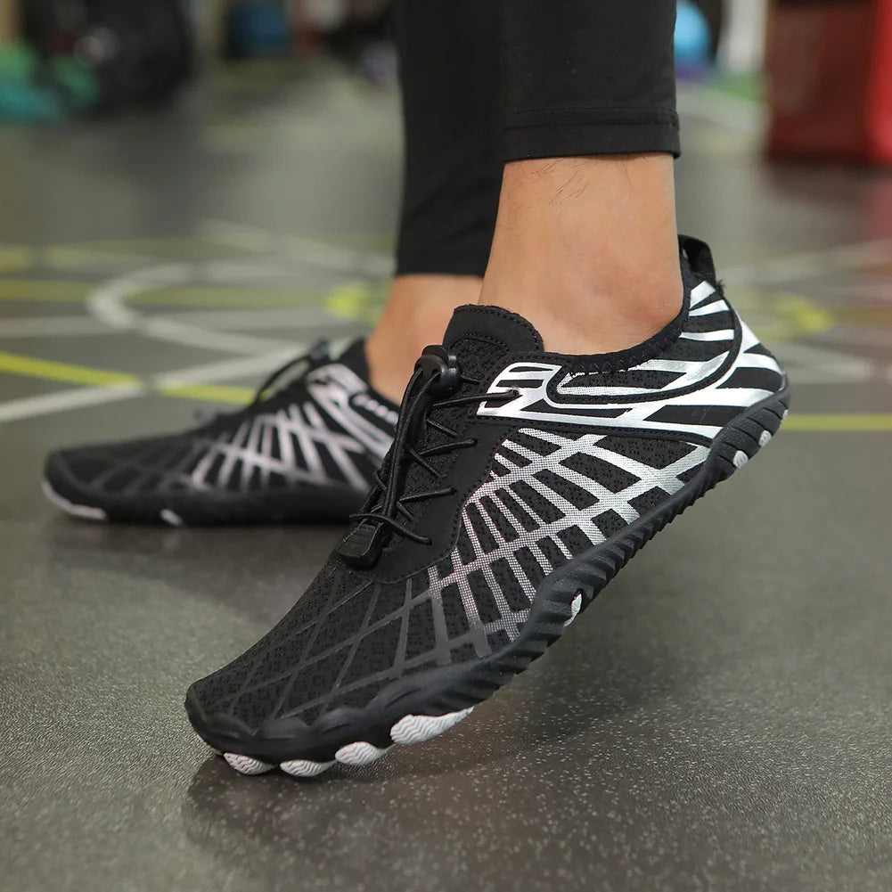 "Women's aqua shoes with breathable fabric, slip-on elastic collar, and grip sole for water sports and beach walks."