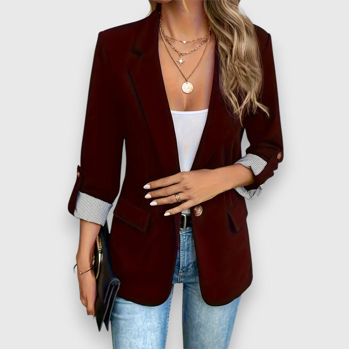 "Women's blazer with notched lapels and rolled cuff sleeves, tailored fit in black, ideal for professional or casual wear."