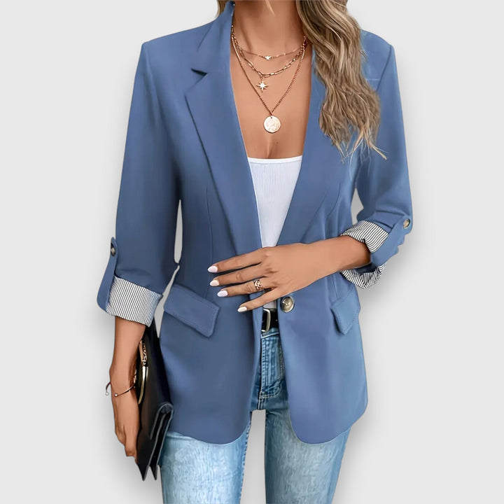 "Women's blazer with notched lapels and rolled cuff sleeves, tailored fit in black, ideal for professional or casual wear."