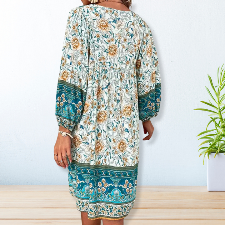"Women's boho floral summer dress, knee-length, long sleeves, relaxed fit, perfect for sunny days."