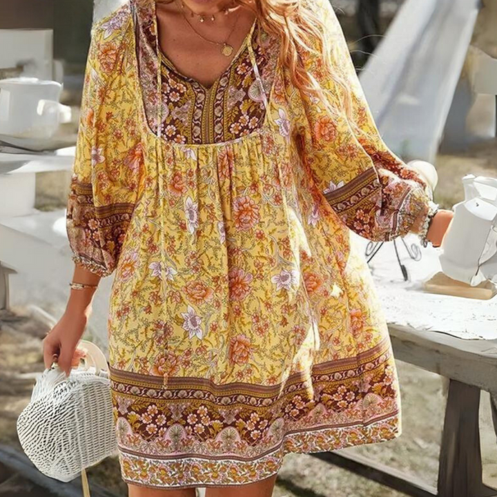 "Women's boho floral summer dress, knee-length, long sleeves, relaxed fit, perfect for sunny days."
