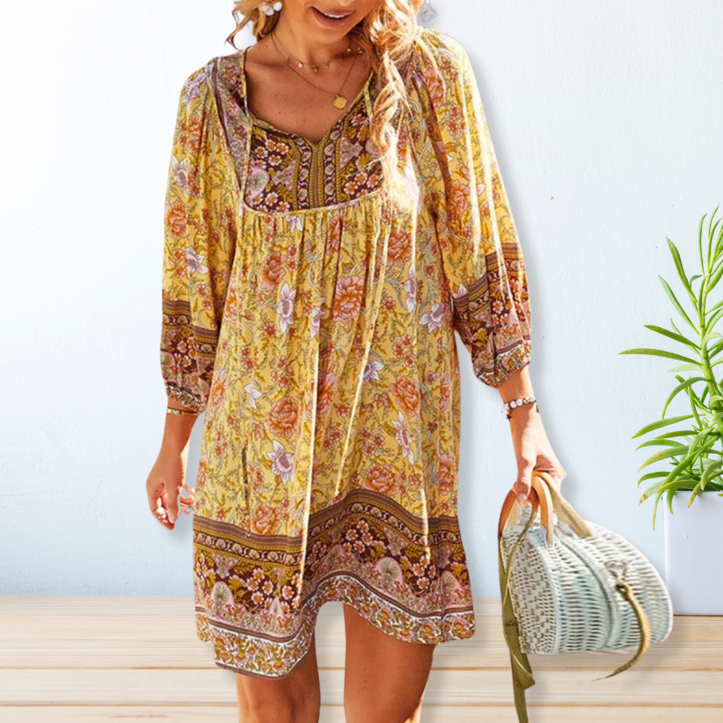 "Women's boho floral summer dress, knee-length, long sleeves, relaxed fit, perfect for sunny days."