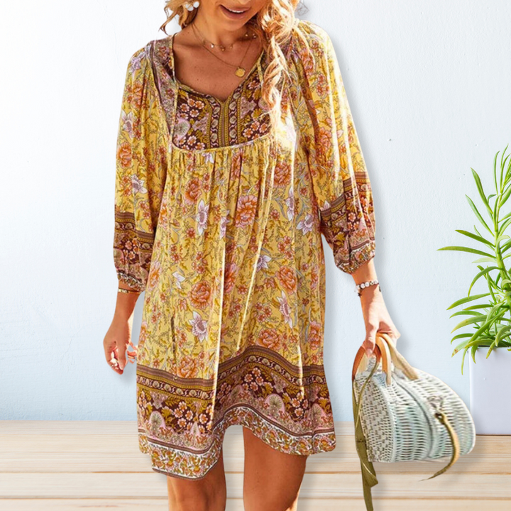 "Women's boho floral summer dress, knee-length, long sleeves, relaxed fit, perfect for sunny days."