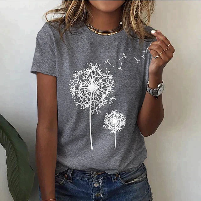 "Women's casual floral T-shirt in black with dandelion print, round neckline, relaxed fit, available in multiple colors."