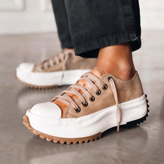 Women's chunky platform sneakers with a bold sole, rounded toe, and trendy contrast details for stylish all-day comfort.