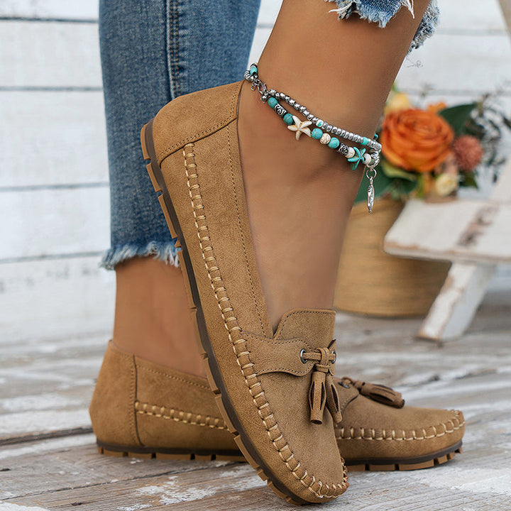 "Women's classic bow loafers in soft suede, stylish flat slip-ons with elegant bow accent, ideal for any occasion."