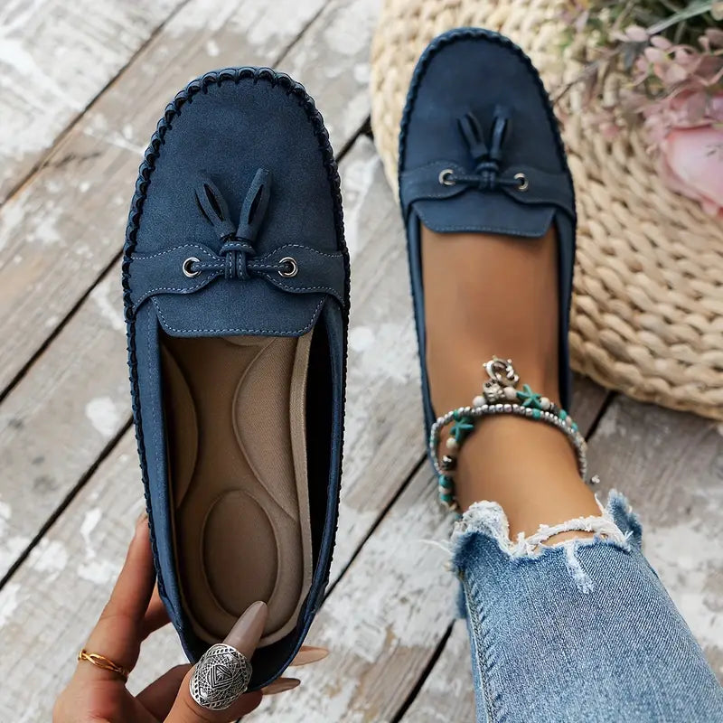 "Women's classic bow loafers in soft suede, stylish flat slip-ons with elegant bow accent, ideal for any occasion."