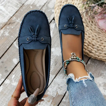 "Women's classic bow loafers in soft suede, stylish flat slip-ons with elegant bow accent, ideal for any occasion."