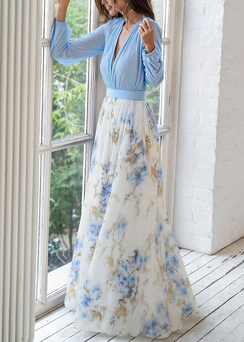 Women's elegant floral maxi dress with V-neckline, sheer long sleeves, and flowing skirt chiffon fabric, front view.