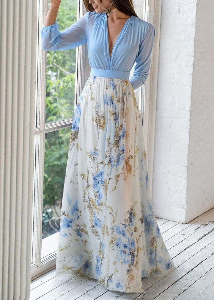 Women's elegant floral maxi dress with V-neckline, sheer long sleeves, and flowing skirt chiffon fabric, front view.