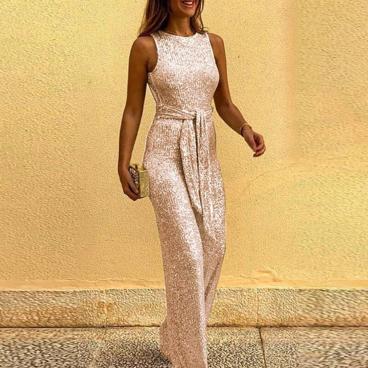"Women's elegant sequin jumpsuit, dazzling and tailored for evening events, sparkles with every move against a plush lining."