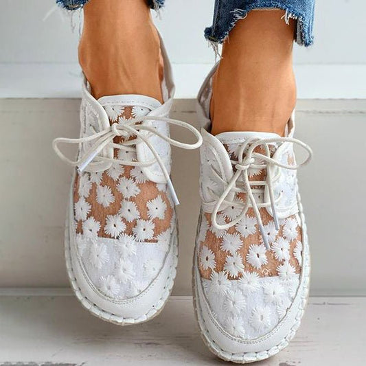 "Women's embroidered lace sneakers with floral mesh design, airy and elegant, featuring cushioned insoles for comfort."
