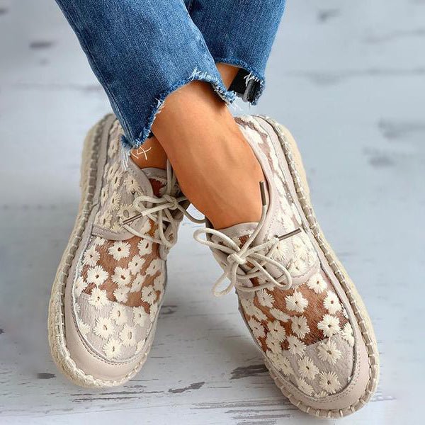 "Women's embroidered lace sneakers with floral mesh design, airy and elegant, featuring cushioned insoles for comfort."