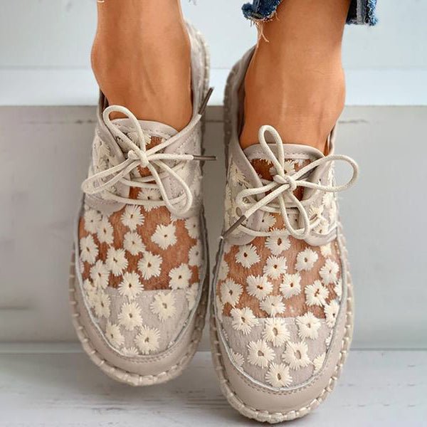 "Women's embroidered lace sneakers with floral mesh design, airy and elegant, featuring cushioned insoles for comfort."