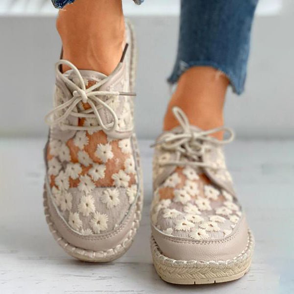 "Women's embroidered lace sneakers with floral mesh design, airy and elegant, featuring cushioned insoles for comfort."