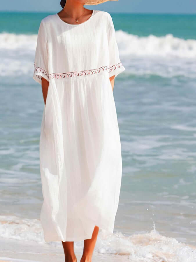 "Women's embroidered loose dress with cotton linen blend, intricate embroidery detailing, comfortable and elegant look."