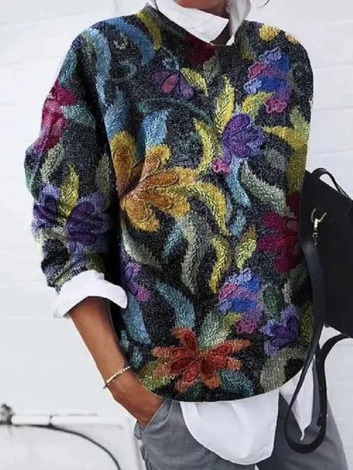 Women's floral geometric sweater with colorful floral and geometric patterns.