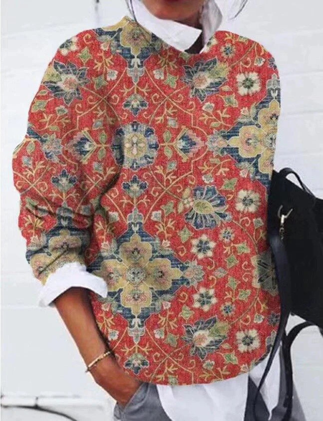 Lifestyle shot of a woman wearing the women's retro floral geometric sweater.