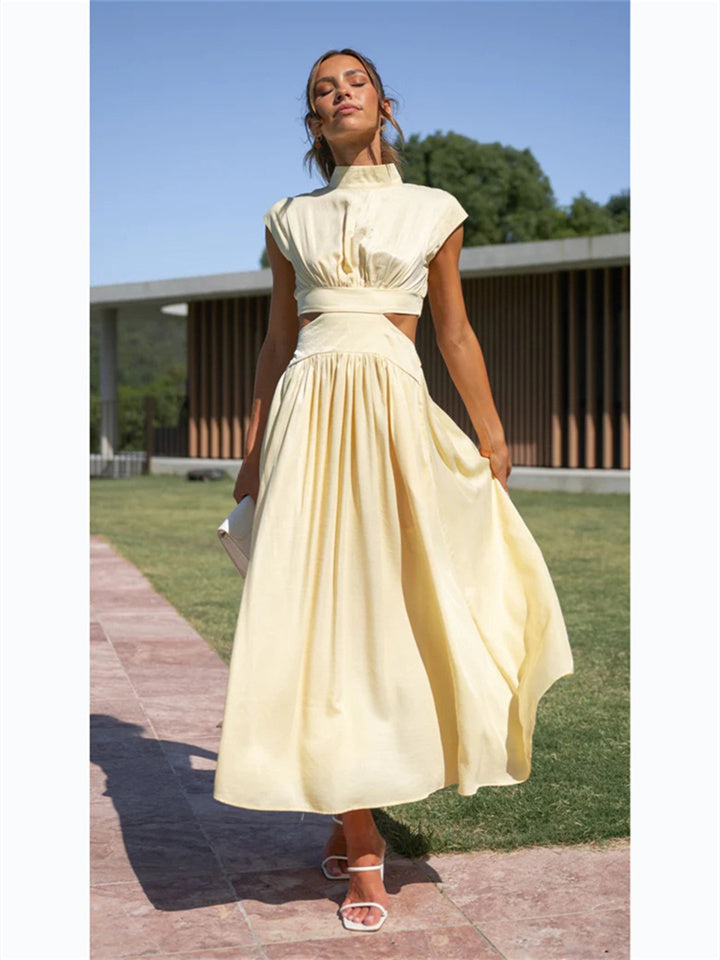 "Women's flowy summer Vespera dress, lightweight and elegant, showing a flattering silhouette for chic sunny day style."