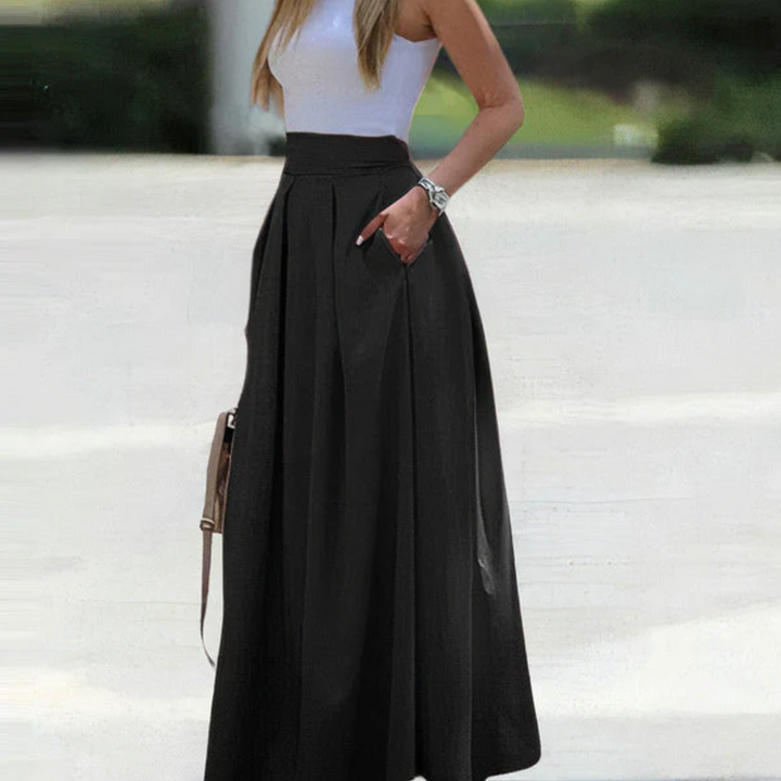 "Women's high waist pleated maxi skirt with elegant pleats, breathable fabric, and pockets for style and comfort."