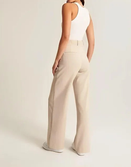 "Women's high-waist wide-leg trousers with pleated front, tailored fit, and soft wool blend for elegant and sophisticated sty