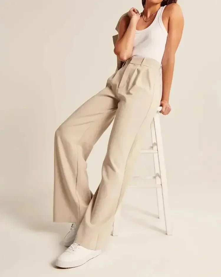 "Women's high-waist wide-leg trousers with pleated front, tailored fit, and soft wool blend for elegant and sophisticated sty