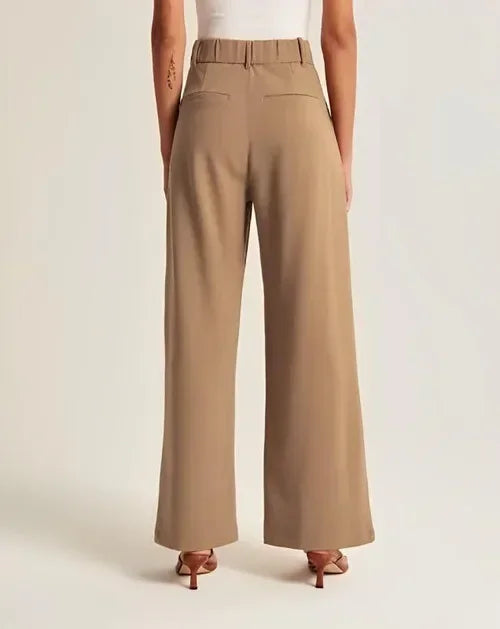 "Women's high-waist wide-leg trousers with pleated front, tailored fit, and soft wool blend for elegant and sophisticated sty