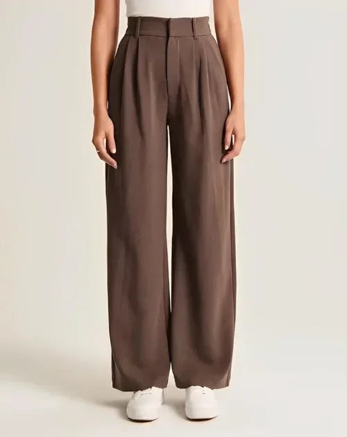 "Women's high-waist wide-leg trousers with pleated front, tailored fit, and soft wool blend for elegant and sophisticated sty
