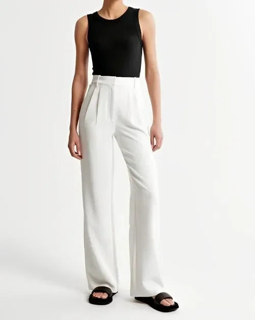 "Women's high-waist wide-leg trousers with pleated front, tailored fit, and soft wool blend for elegant and sophisticated sty