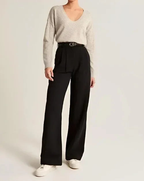 "Women's high-waist wide-leg trousers with pleated front, tailored fit, and soft wool blend for elegant and sophisticated sty