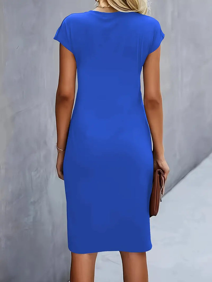 Women's knee-length sheath dress with cap sleeves and ruched waist, offering a flattering fit and elegant silhouette for any 