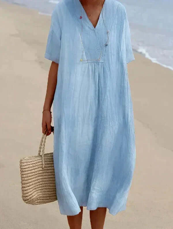 "Women's linen cotton summer dress, airy and breathable in pink, stylish modern silhouette, perfect for warm days."
