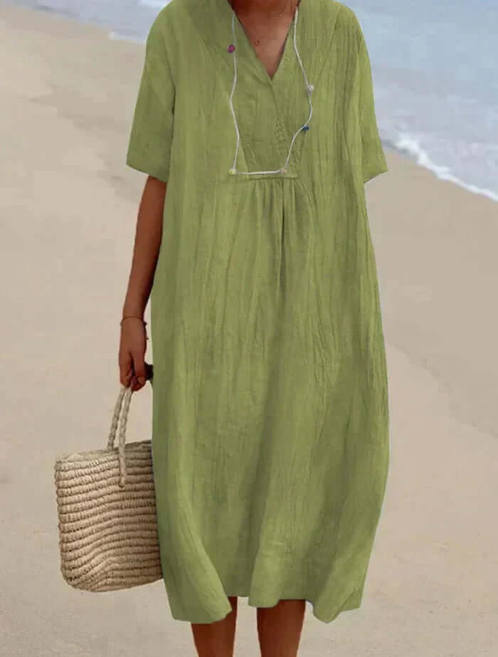 "Women's linen cotton summer dress, airy and breathable in pink, stylish modern silhouette, perfect for warm days."