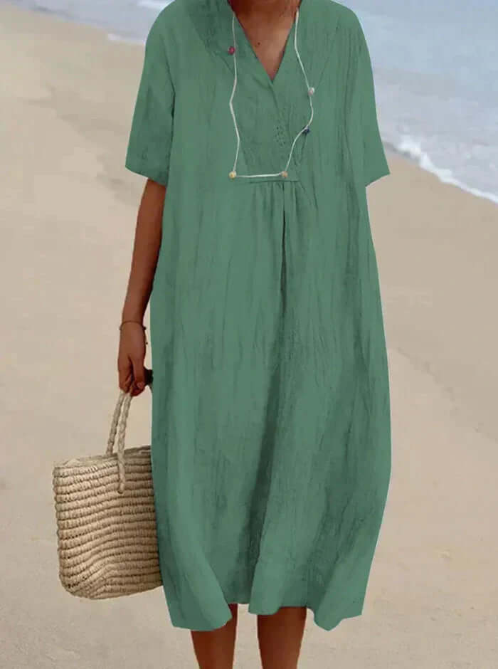 "Women's linen cotton summer dress, airy and breathable in pink, stylish modern silhouette, perfect for warm days."