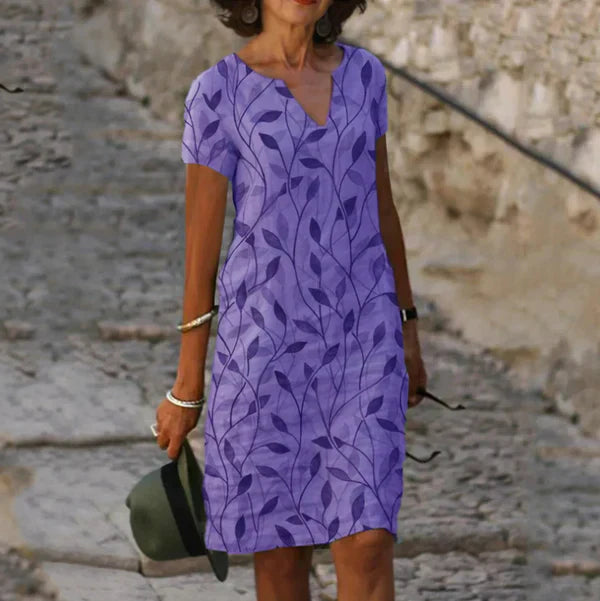 "Women's linen leaf print V-neck mini dress, light fabric, charming summer design with flattering fit, perfect for any occasi