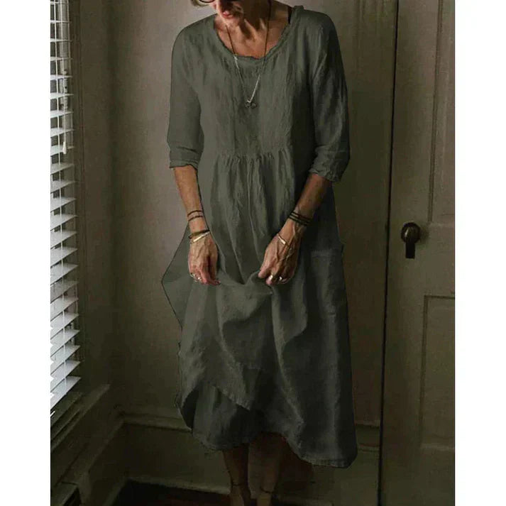 "Women's Loose Fit Cotton Linen Midi Dress with round neck, 3/4 sleeves, asymmetric hem, and pockets in various colors."