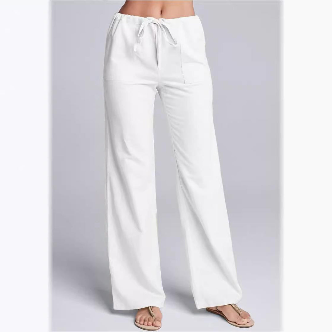 Women's loose fit cotton linen trousers with drawstring waist; breathable, casual style, full-length for relaxed occasions.