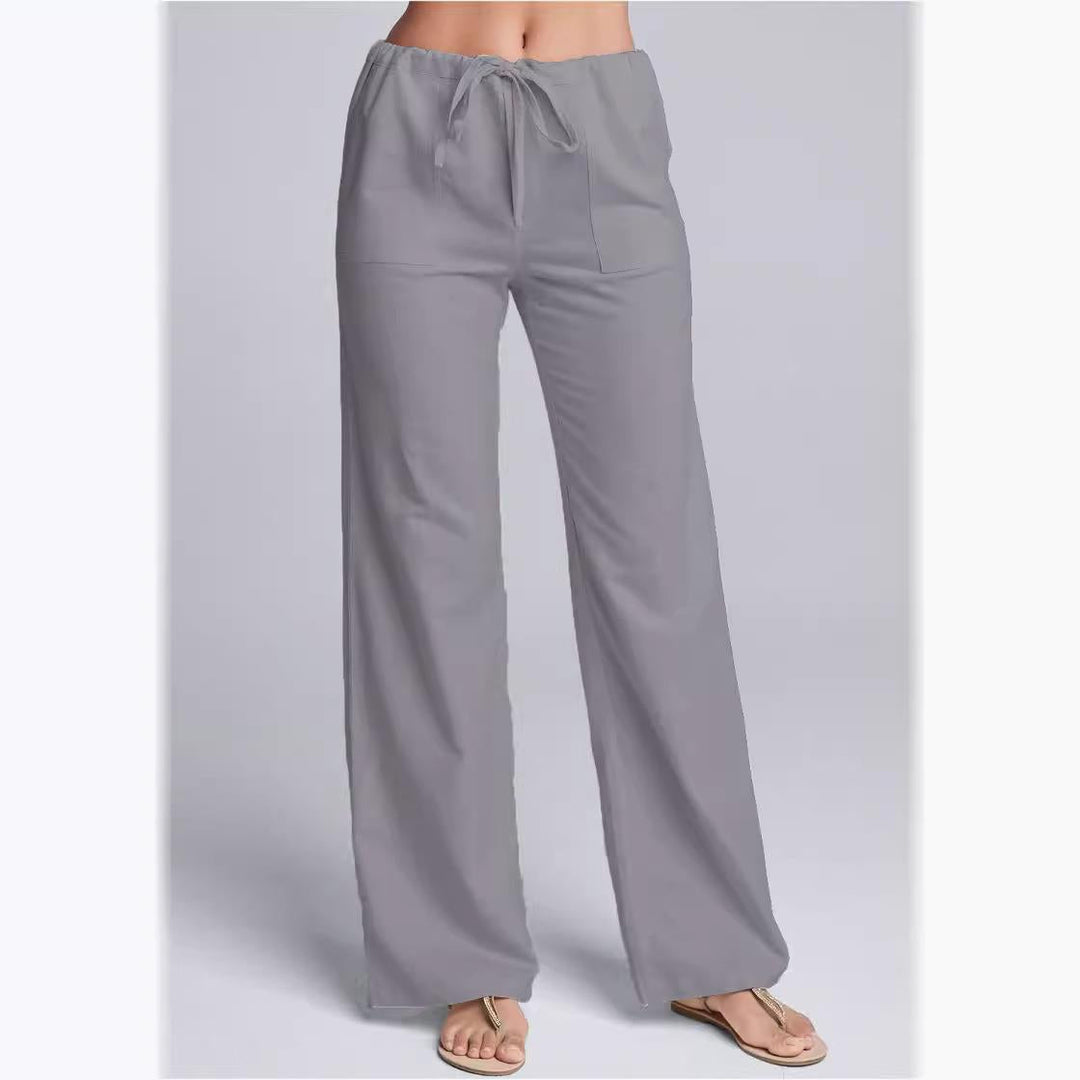 Women's loose fit cotton linen trousers with drawstring waist; breathable, casual style, full-length for relaxed occasions.
