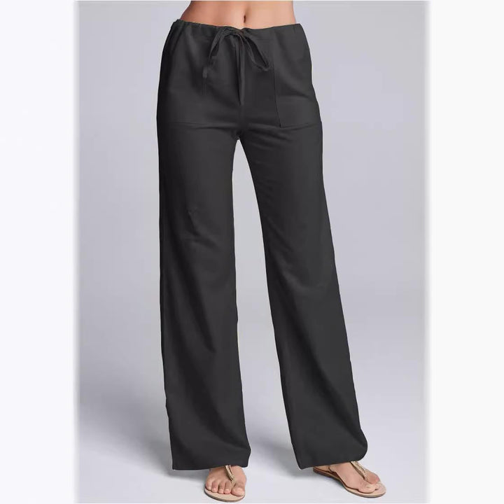 Women's loose fit cotton linen trousers with drawstring waist; breathable, casual style, full-length for relaxed occasions.