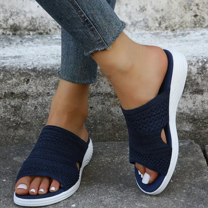 "Women's orthopedic open-toe knit sandals with contoured sole, stretch-knit upper, and slip-on design for comfort and style."